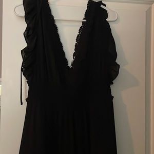 Black, long, Lacey detailed in the chest and bottom of dress
